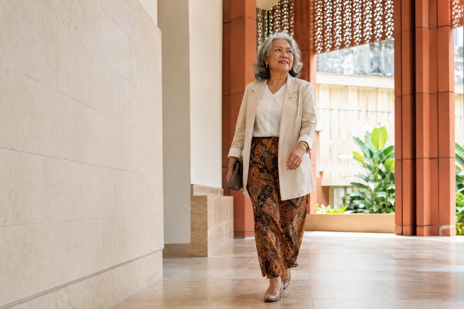 Asian woman leader standing in modern Malaysian architecture